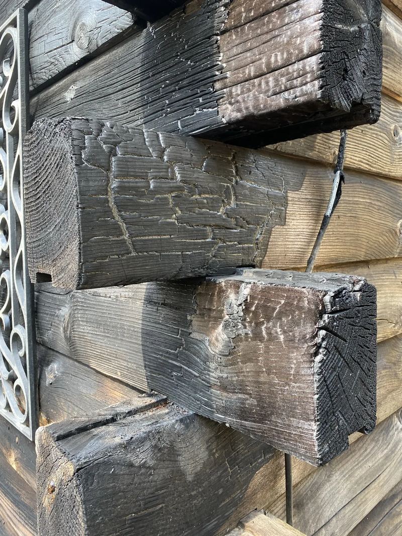 Fire and smoke damage to interior walls and ceiling documented for restoration