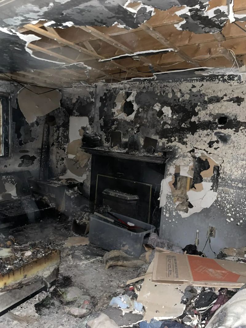 Fire damage assessment showing thermal damage to wall finishes and electrical