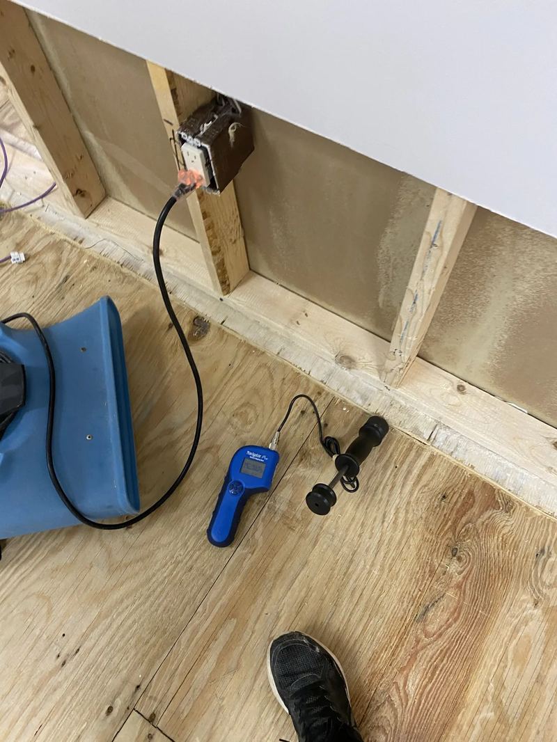 Floor drying mat system installed on hardwood to save the floor without removal
