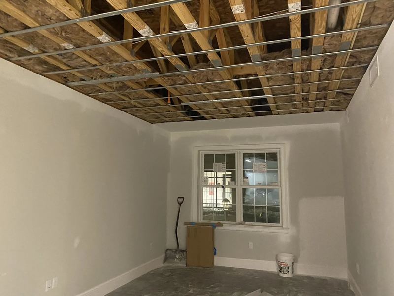 Pro GC water damage restoration crew extracting standing water from a flooded interior